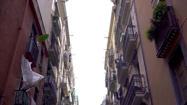 Small Barcelona alley with old buildings in residential neighborhood in the Raval