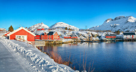 Captivating morning seascape of Norwegian sea and cityscape of Sorvagen town. © pilat666