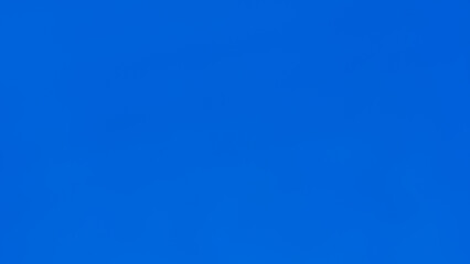 Abstract blurry gradient background with blue sky colors.