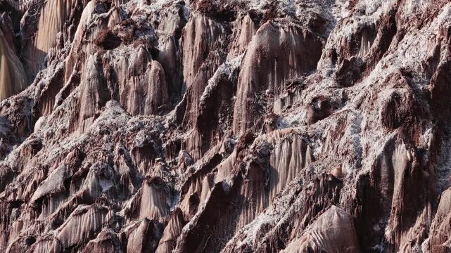 Colorful salt mountains on Hormuz Island in Iran, known as the Rainbow Island, featuring surreal mineral Martian landscape and vivid natural patterns in Persian Gulf. Unique geological formations and 