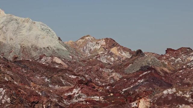 Colorful salt mountains on Hormuz Island in Iran, known as the Rainbow Island, featuring surreal mineral Martian landscape and vivid natural patterns in Persian Gulf. Unique geological formations and 