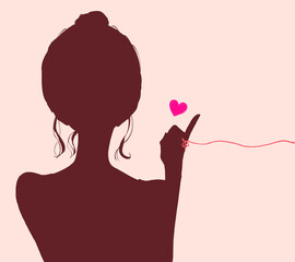 運命の赤い糸を結んだお団子頭の女性　シルエット