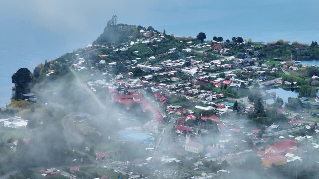 Drone shot of Puerto Octay city on lakeshore with scenic Lake Llanquihue in Los Lagos, Chile