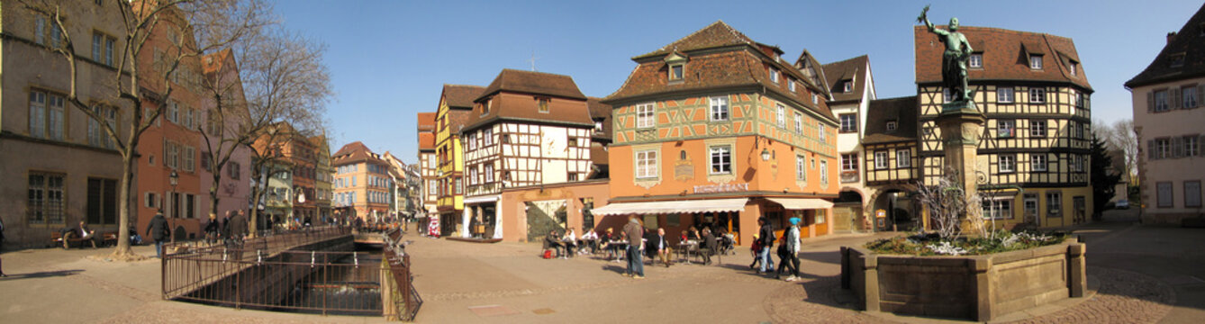 Panoramic March 2011 view of Place de l'Ancienne Douane, showing half-timbered houses, Fontaine Schwendi, and historic center, DE, 05 Mart 2011
