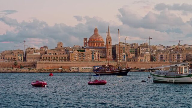 View of Valletta's of Capital City of Malta at sunny day. Marsamxett Harbour with the view on Valletta Saint Paul's Anglican Cathedral