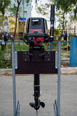 Outboard motor on a transport trolley.