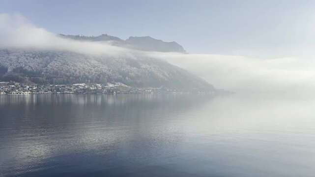 Traunsee lake with Traunstein with seagulls in winter