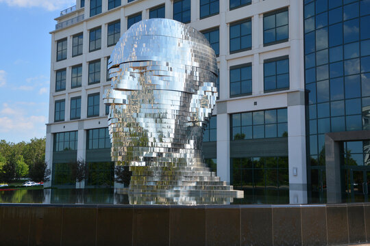 METALmorphosis is a large (7 meters; weighing 13 tons) kinetic sculpture of a human head, by Czech artist David Čern&yacute;. The sculpture is in the Whitehall Corporate Center in Charlotte, North Carolina, 