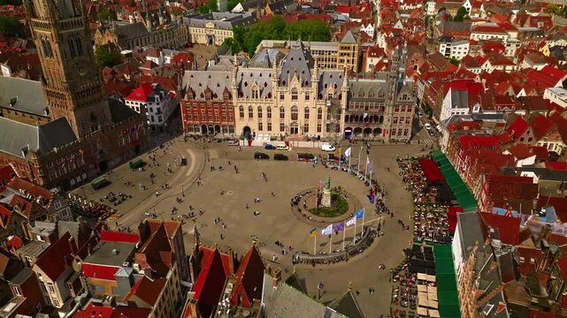 Aerial view of Bruges with historic Markt square and the Belfry Tower surrounder a sunny day