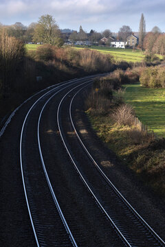 Railway tracks catching the light outside town of Hungerford, Berkshire, England, United Kingdom, Europe
