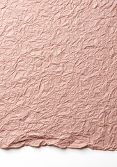 Close up of crumpled textured paper in a muted dusty rose color