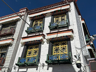 Traditional architecture and video cameras at the crossroads along the Barkhor Ring Road at Lhasa City, Tibet, China