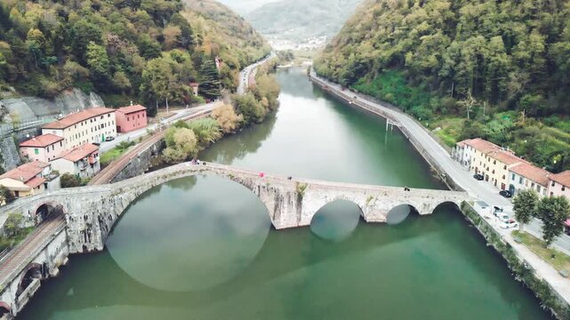 Aerial overhead view of Devils Bridge-Ponte della Maddalena is a bridge crossing the Serchio river near the town of Lucca