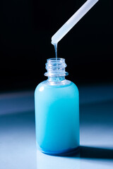 Blue Copper peptides skin repairing serum in transparent bottle. Face and skin beauty routine themes