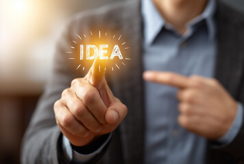 a businessman is interacting on the word "idea", illustrating the business concept of ideas and innovation 