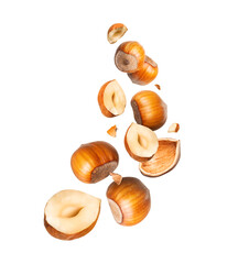 Dried crushed hazelnuts in the air close-up isolated on a transparent background