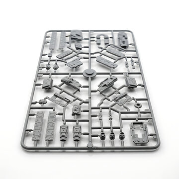 Plastic model kit sprue with various parts on a white background, detailed engineering components