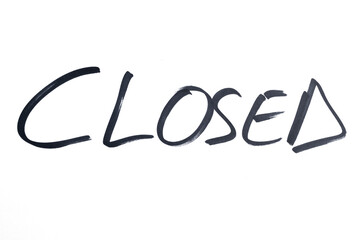 the word CLOSED written in black marker