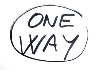 the word ONE WAY written in black marker