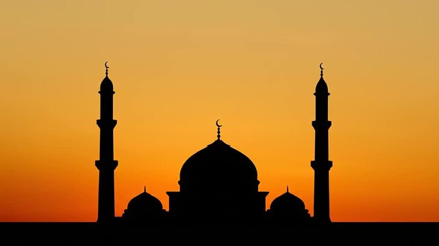 Silhouette of a mosque against a vibrant orange sunset sky, showcasing its iconic domes and minarets