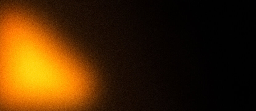 Fiery orange yellow glow noise gradient background with dark blur