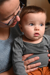 Mother talking to her young child, close-up.