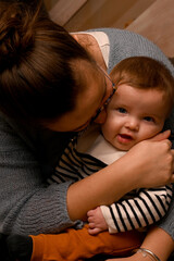 close-up of a mother playing with her smiling young child