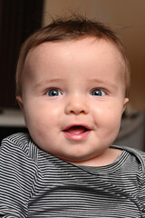 close-up of a mother playing with her smiling young child