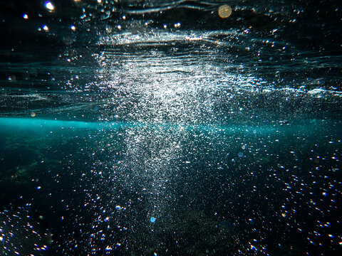 Bubbles under the sea in the crystal clear green sea water. Mediterranean bubbles. Real image very suitable for backgrounds, Rising Bubbles in Deep Underwater, Under with bubble. Great for background.