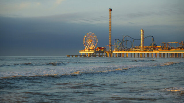 Ocean waves and the historic pier in Galveston, Texas USA