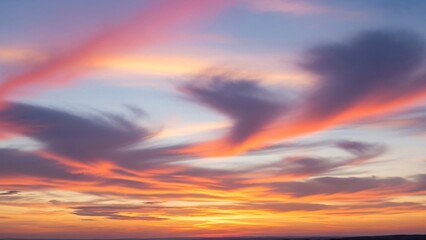 Obraz premium Vibrant sunset sky with dynamic cloud formations and warm color gradients