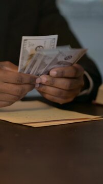 Close up of African Male Lawyer Recieving and Counting Money, Vertical Video