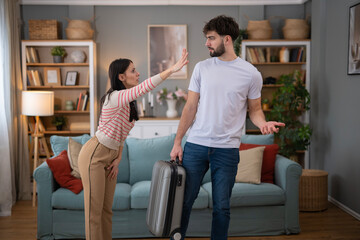 Naklejka premium Couple having relationship problems, man leaving home