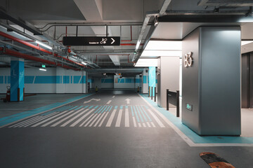 Empty underground parking garage level B3 with directional signage and marked lanes © zhu difeng