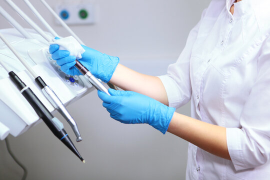 Cleaning procedure in modern dental clinic after receiving patient. Concept of cleanliness and health. Disinfection and cleaning in dental office. Patient safety in modern medical conditions.