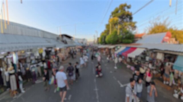 BANGKOK, THAILAND - NOV 2025 : Blurred view of Chatuchak Weekend Market. Largest market in Thailand. Travel and tourism concept video.