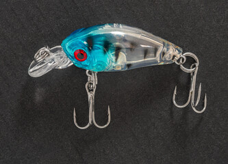 Fishing tackle, wobbler close-up on a black background