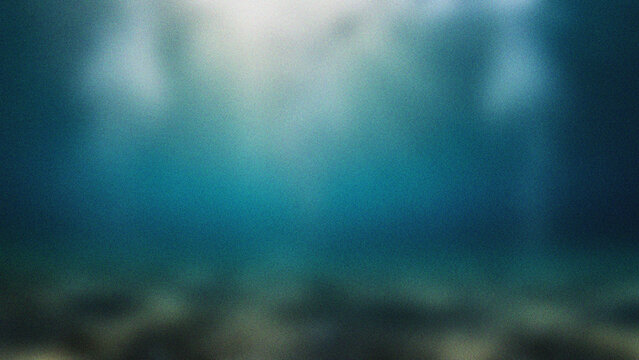 Underwater Sunlight Rays Shining Through Deep Blue Ocean Water