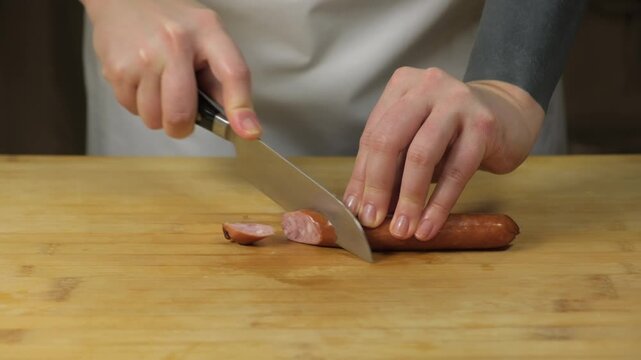 How to slice a hot dog for a quick meal or snack in the kitchen