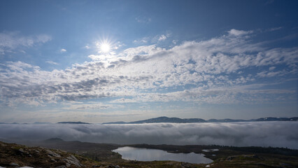 Fototapeta premium Scenic View of Fjordruta in Norway with Sun and Clouds