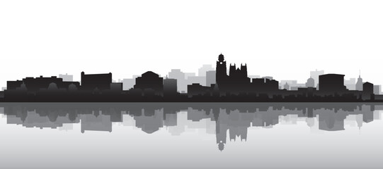 Obraz premium Black and white panoramic poster of the city skyline with misty background buildings and water reflection of NANTES, FRANCE