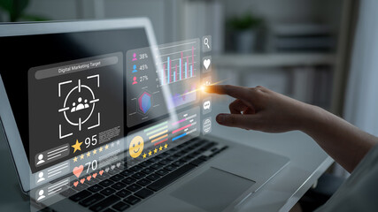 Obraz premium A person interacts with a futuristic laptop display that showcases digital marketing metrics and engagement data, highlighting modern technology in a business setting. Gantry