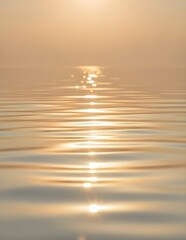 Golden Reflections on the Water: The sun gracefully kisses the calm water, casting a mesmerizing dance of light and reflection across the rippling surface. A serene landscape of light and shadow.