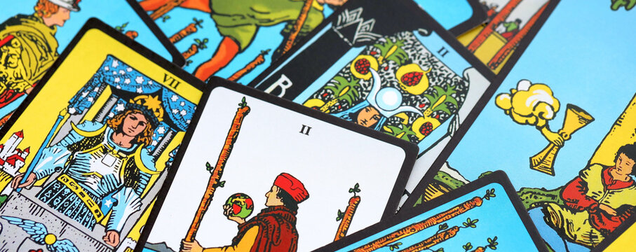 Tarot cards spread on a wooden table for divination and fortune telling