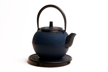 Blue cast iron tetsubin teapot on white, traditional japanese tea ceremony item