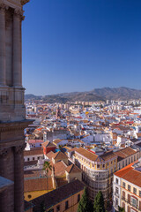 Obraz premium Cityscape view of Malaga from the Cathedral with historic center and mountains