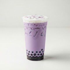 A refreshing purple bubble tea drink topped with creamy whipped topping and pearls.