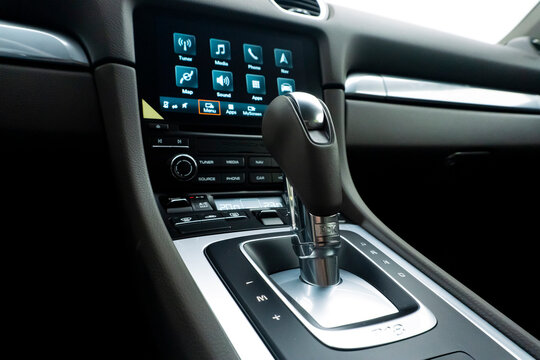 Porsche 718 Cayman center console and infotainment screen, Luxury sports car interior with PDK shifter and navigation system