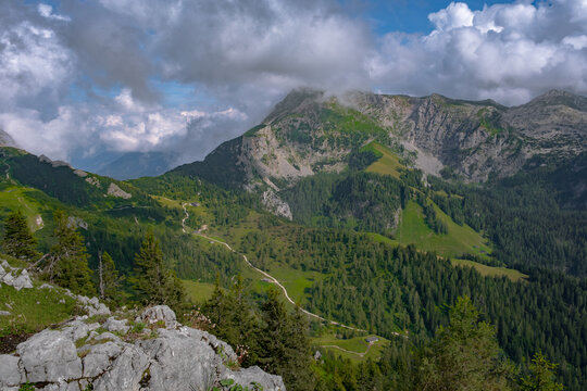 Large rocky mountains in Germany covered with a dense pine forest on a summer day