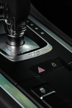Porsche 718 Cayman PDK shifter and model designation, Luxury sports car interior center console detail